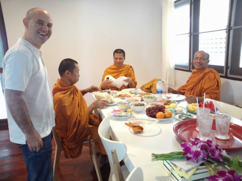 Offering lunch to monks at Expique's Tamboon Baan