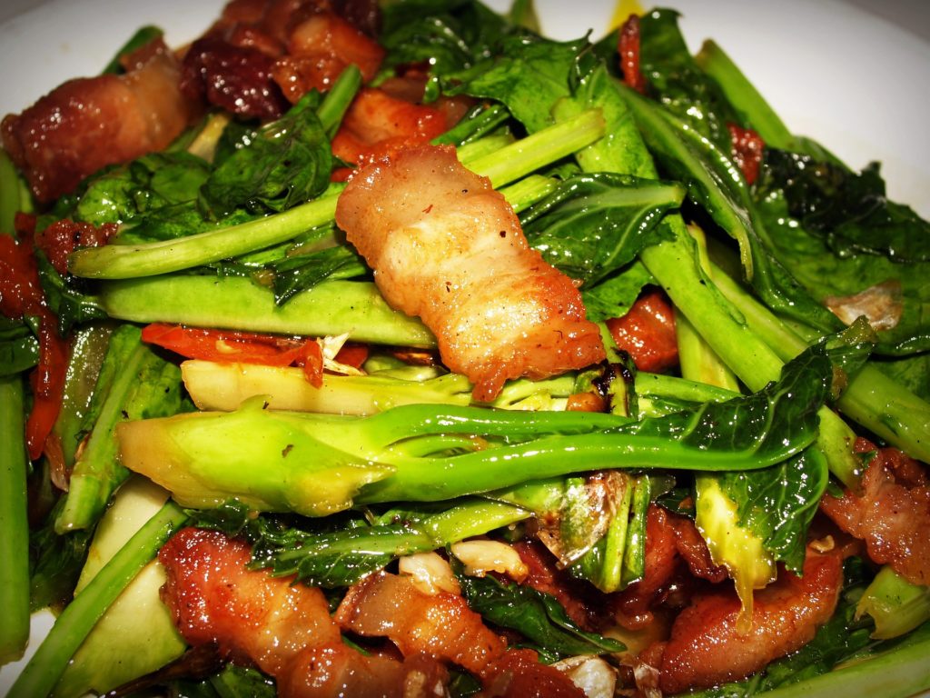 Pad kana moo grob stir-fried kale and crispy pork - photo in the public domain via Pixabay