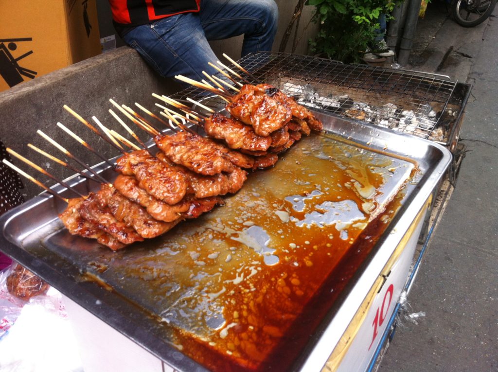 Moo ping pork skewers in Bangkok, Thailand - photo by Chris Wotton