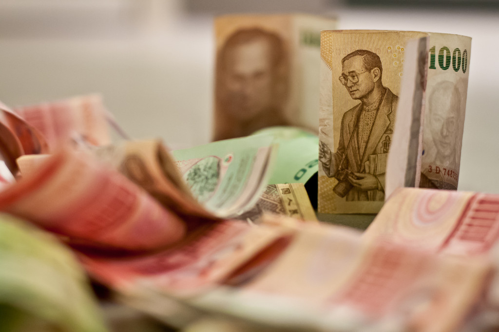Current Thai King Rama IX shown on Thai bank notes - photo by Natasia Causse