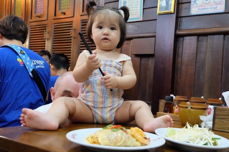 Cute baby eating Pad Thai at Thip Samai