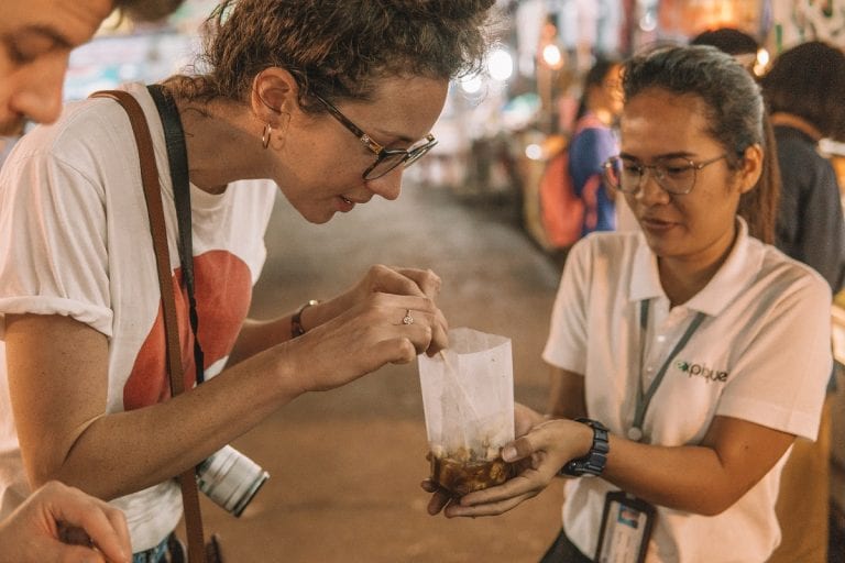 Guest trying new Thai snacks