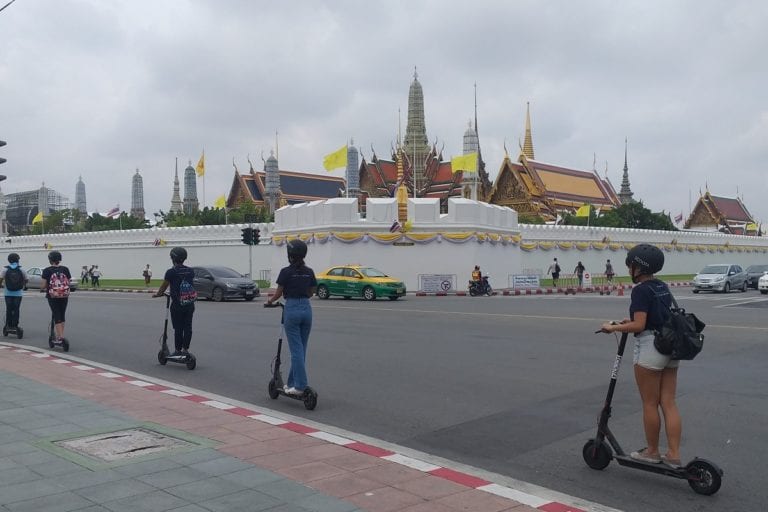 Riding an eScooter passed the Grand Palace