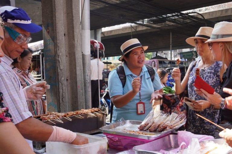 Stopping at a Moo Ping (grilled pork) vendor in Bangrak