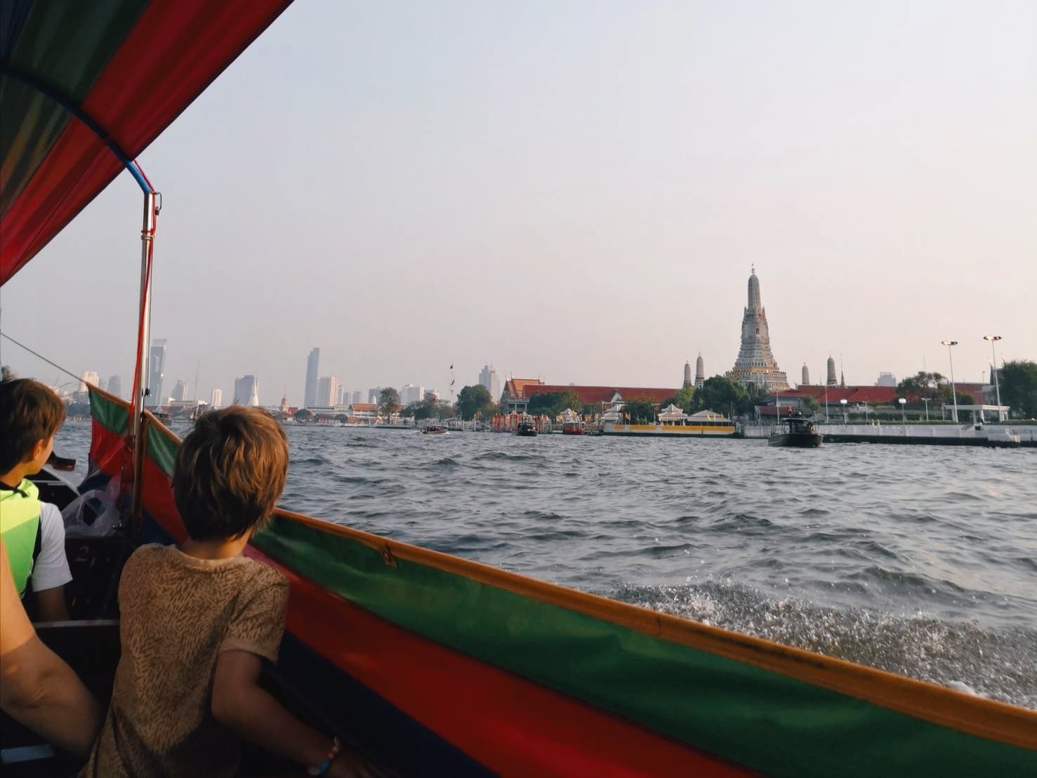 Kids on a lontail boat