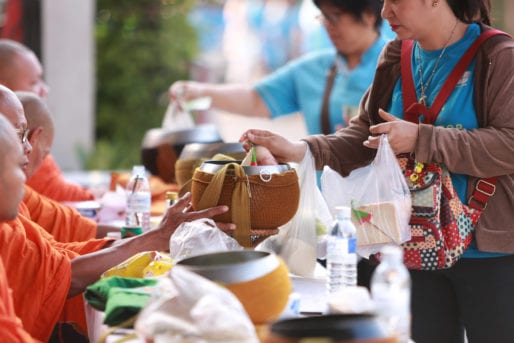 Giving alms to monks