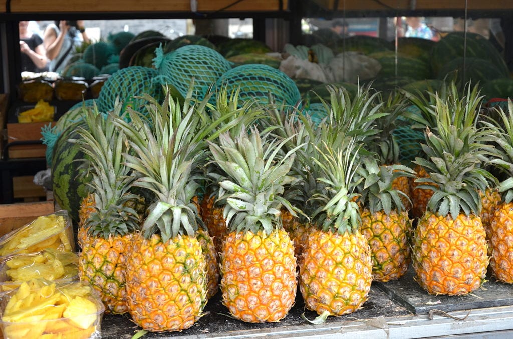 Image of pineapples placing on a stall