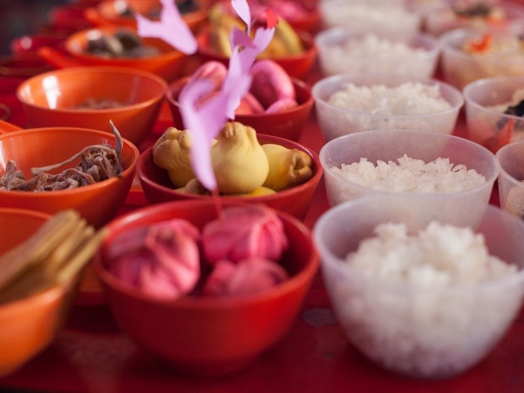 Offering food for Hungry Ghost in Tenth Lunar Month Festival