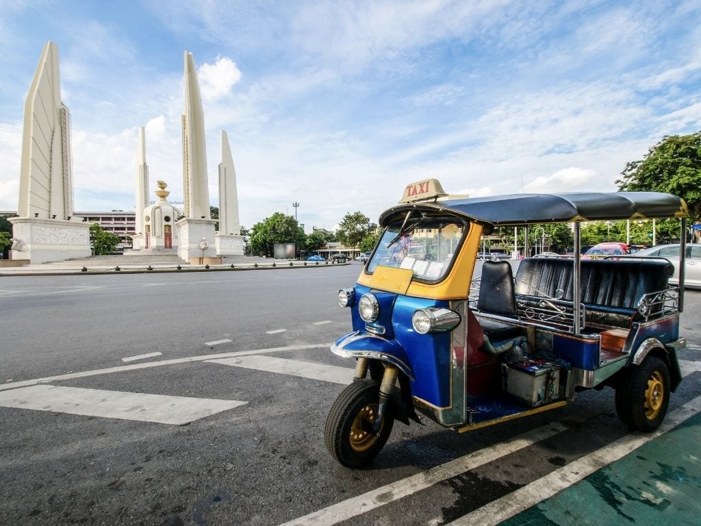 tuk tuk in front of Democracy Monument