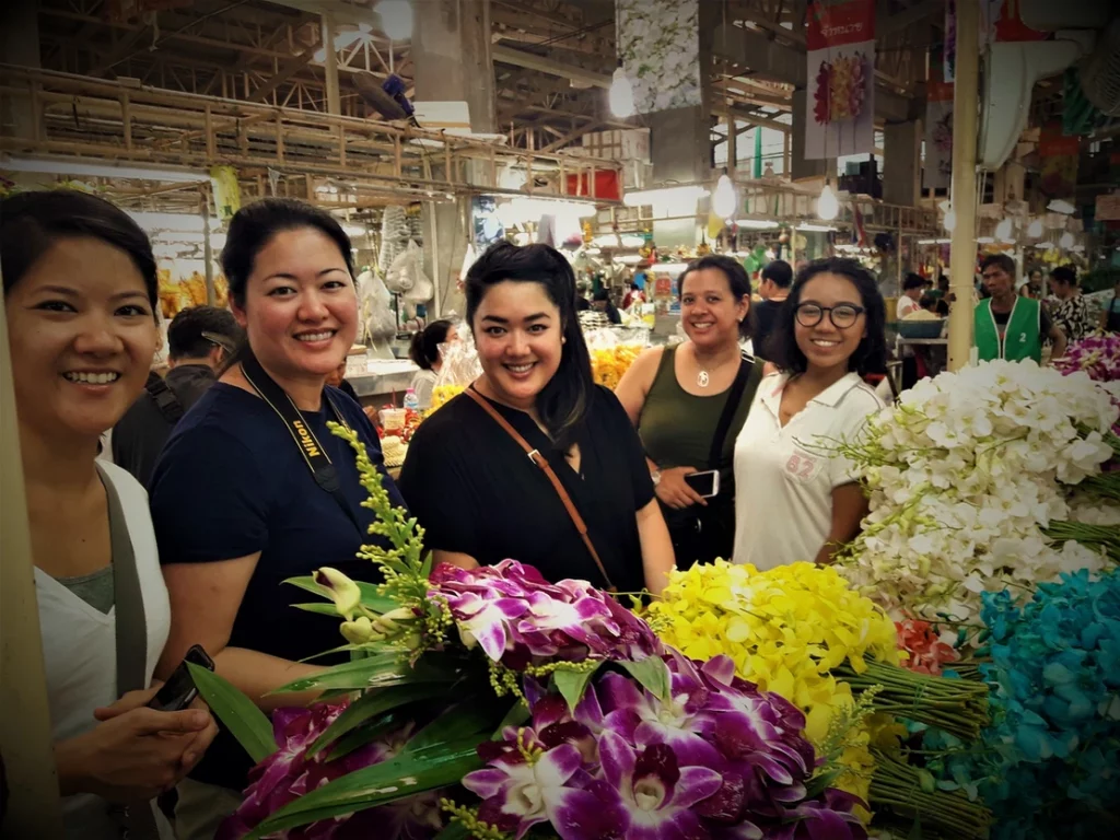 People enjoying a visit to the Flower Market in Bangkok